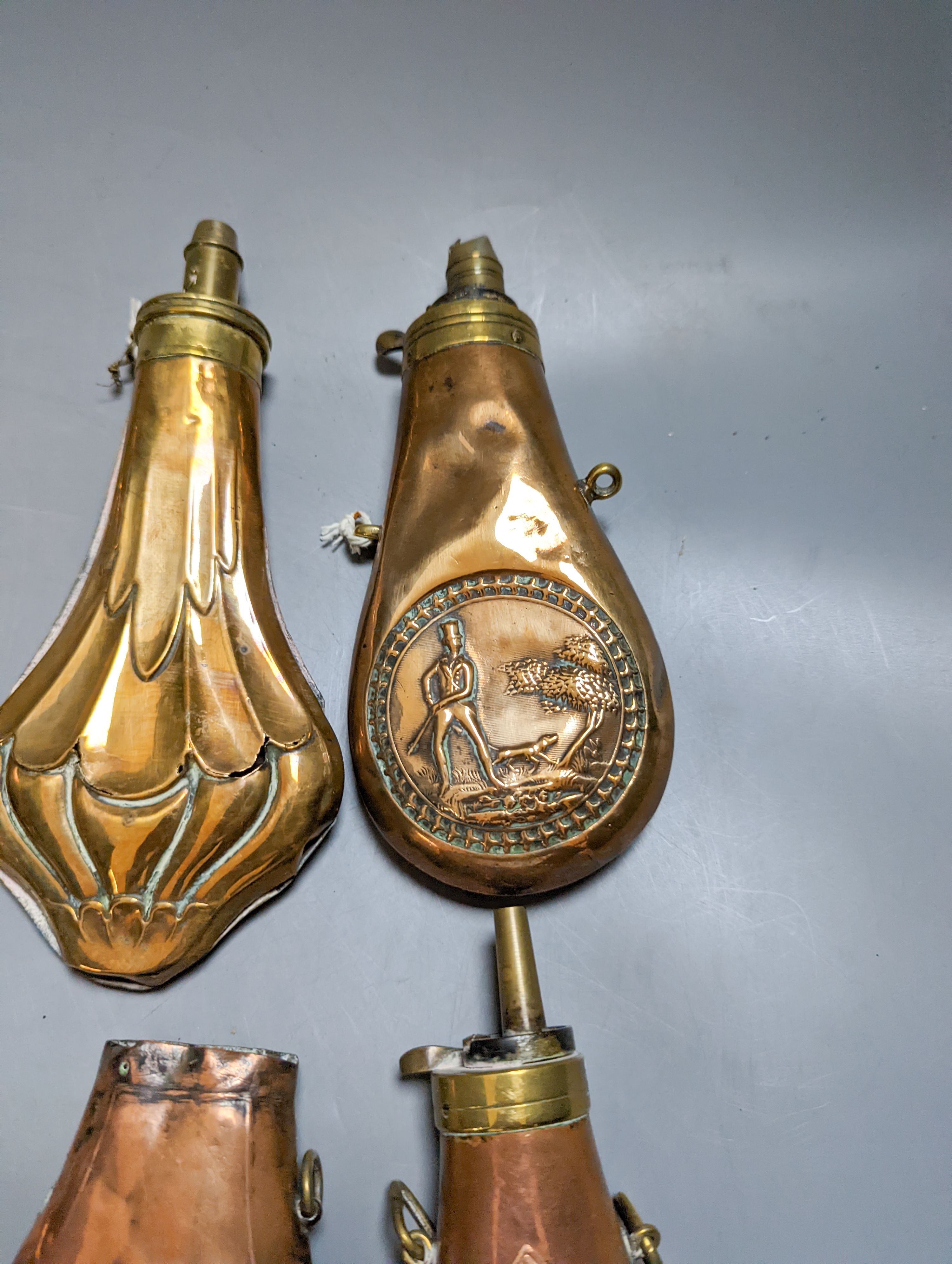 Eight assorted 19th century copper shot flasks